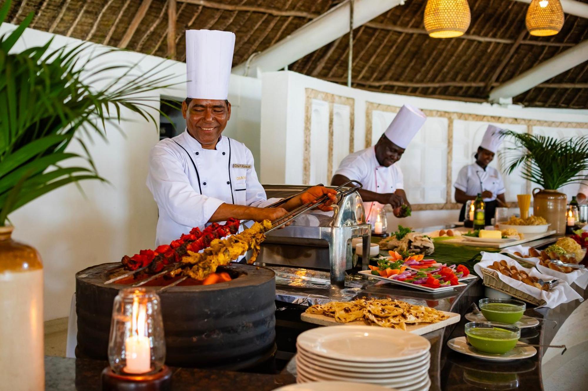 Diamonds Leisure Beach & Golf Resort Diani Beach Exterior foto A buffet at a resort